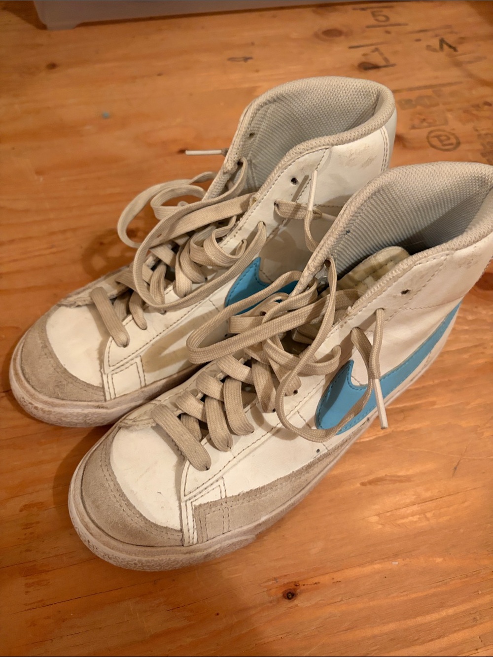 Nike White High-Top Sneakers with Blue Swoosh